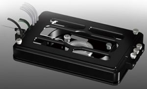 A scientific incubator that is black with metal clasps on the side.